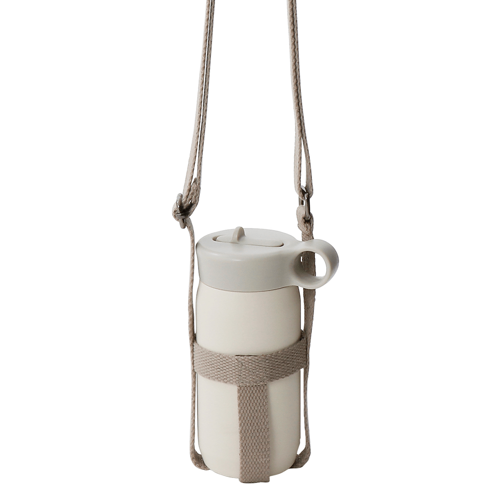 White water bottle with a beige strap and handle suspended in mid-air.