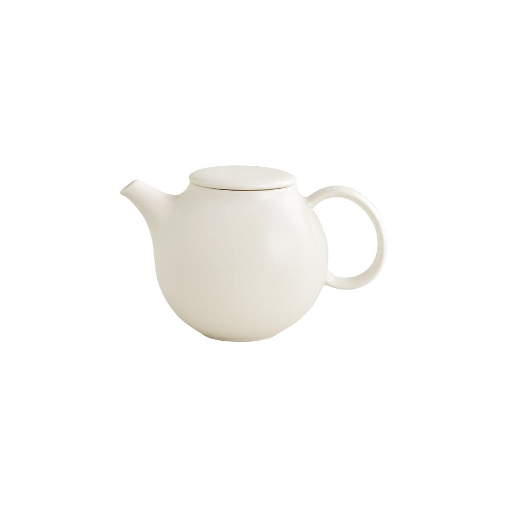 White ceramic teapot with a round body and lid, and a handle.