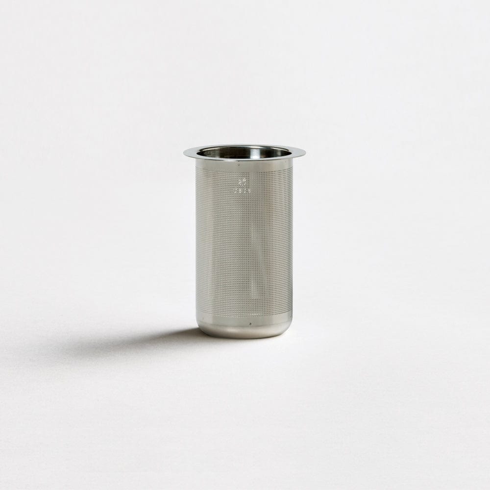 Stainless steel cylindrical tea strainer with a perforated design.