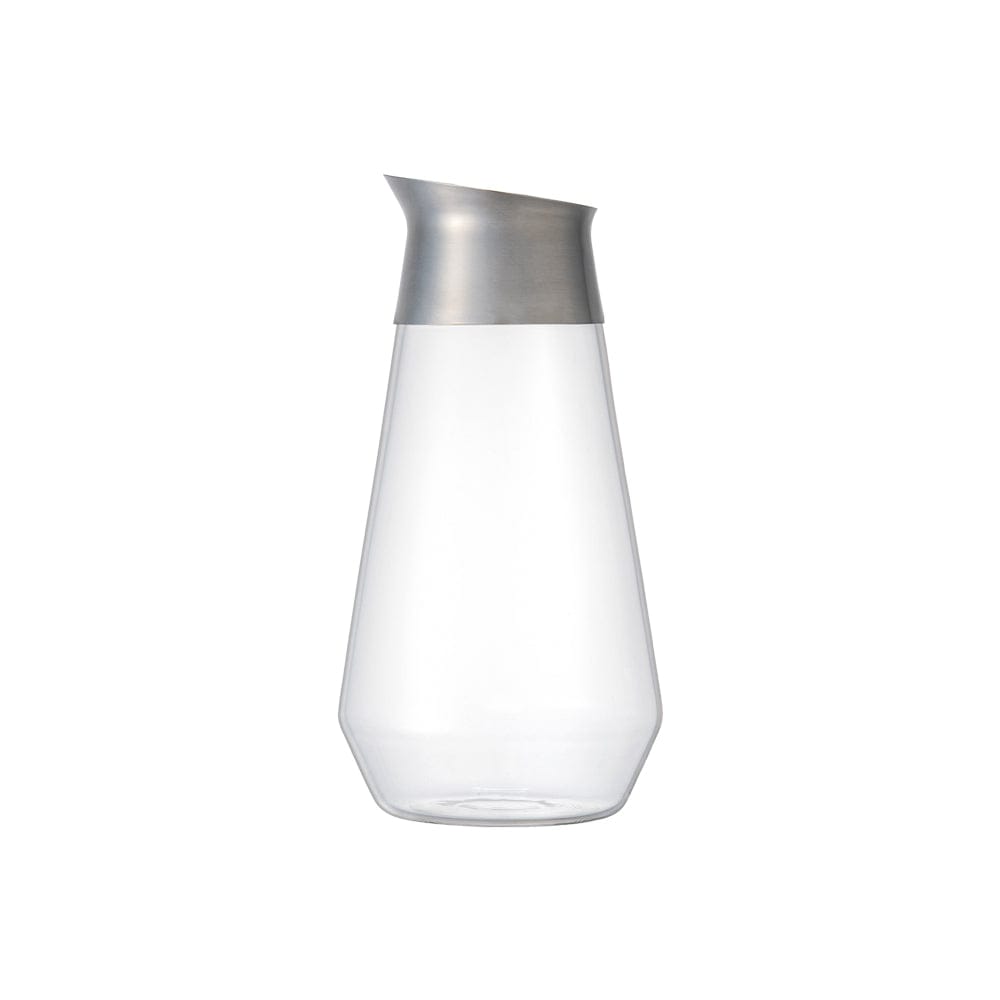 Clear glass pitcher with a metal pour spout, on a white background.