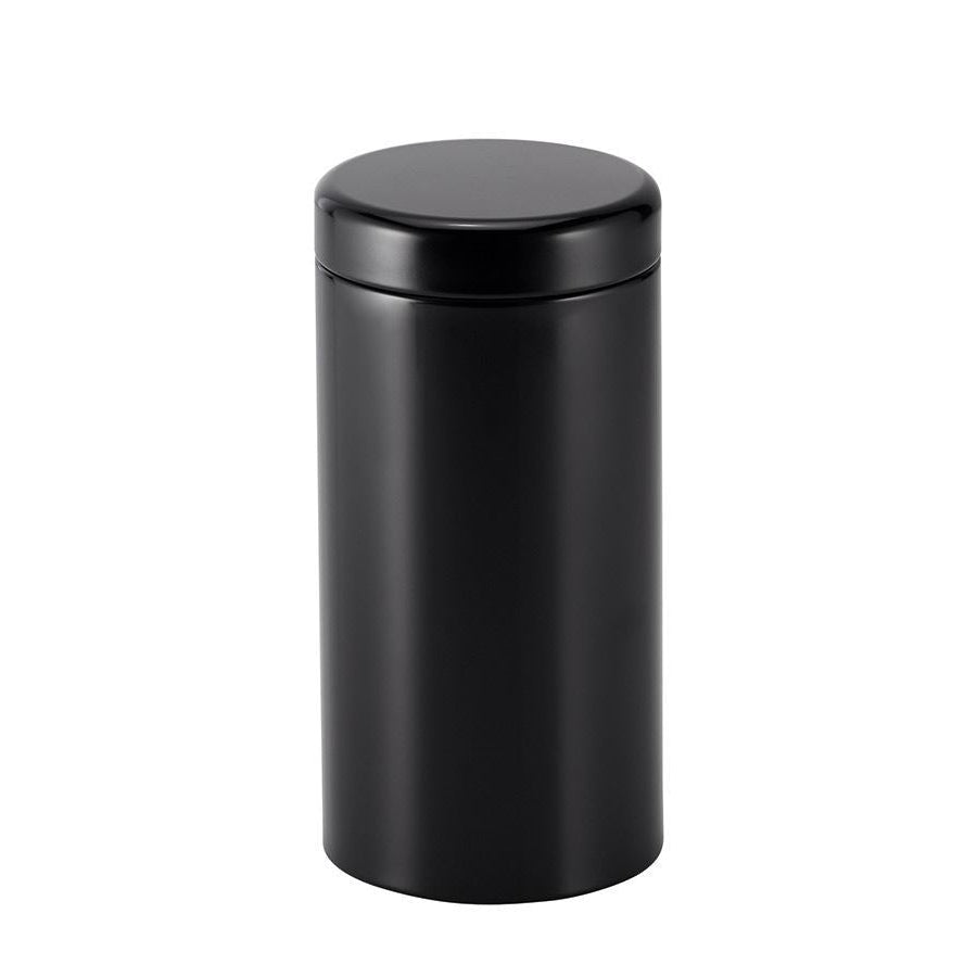 Sleek black cylindrical tin on a white background.