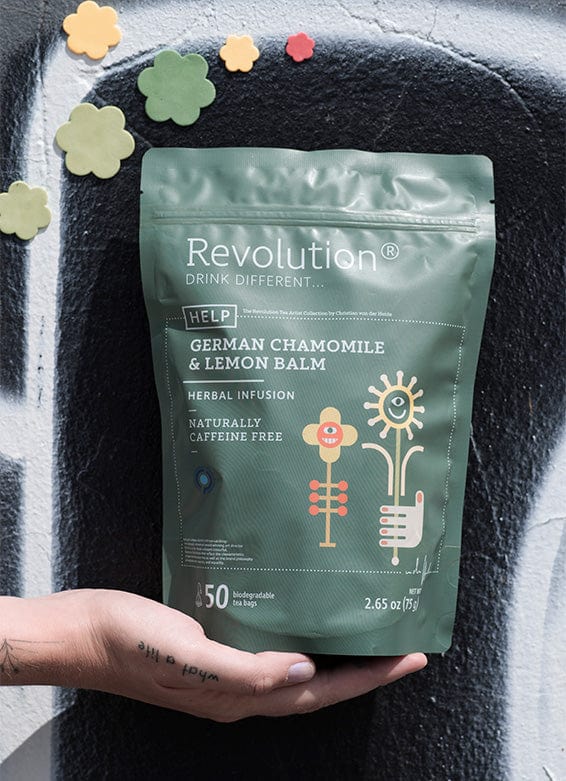 Hand under German Chamomile & Lemon Balm herbal infusion pouch; cloud decals above.