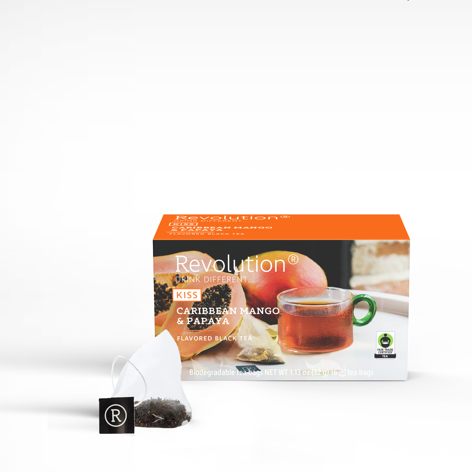 Mango papaya tea box, glass cup, open tea bag with label.