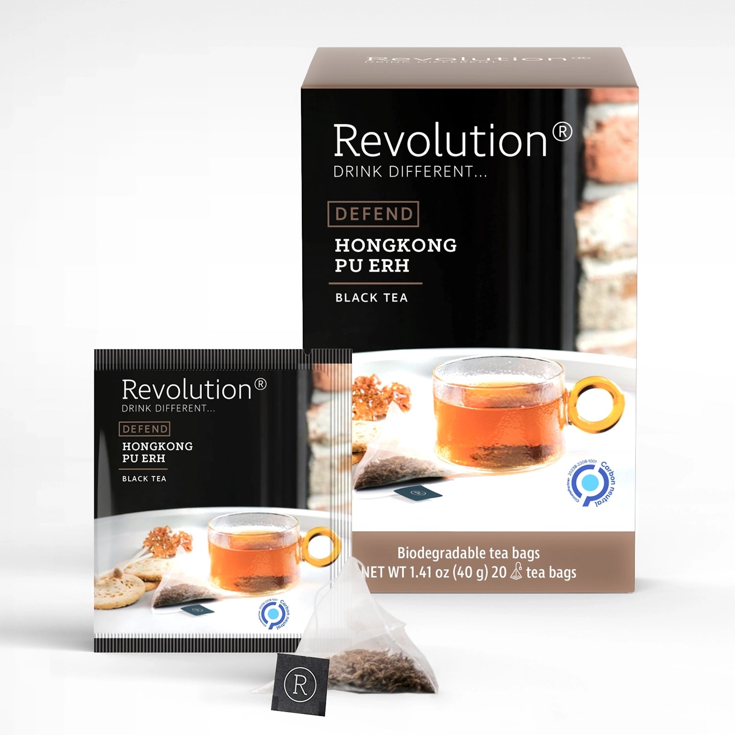 Packet and box of Defend Hongkong Pu Erh black tea with a cup and tea. 20 biodegradable tea bags.
