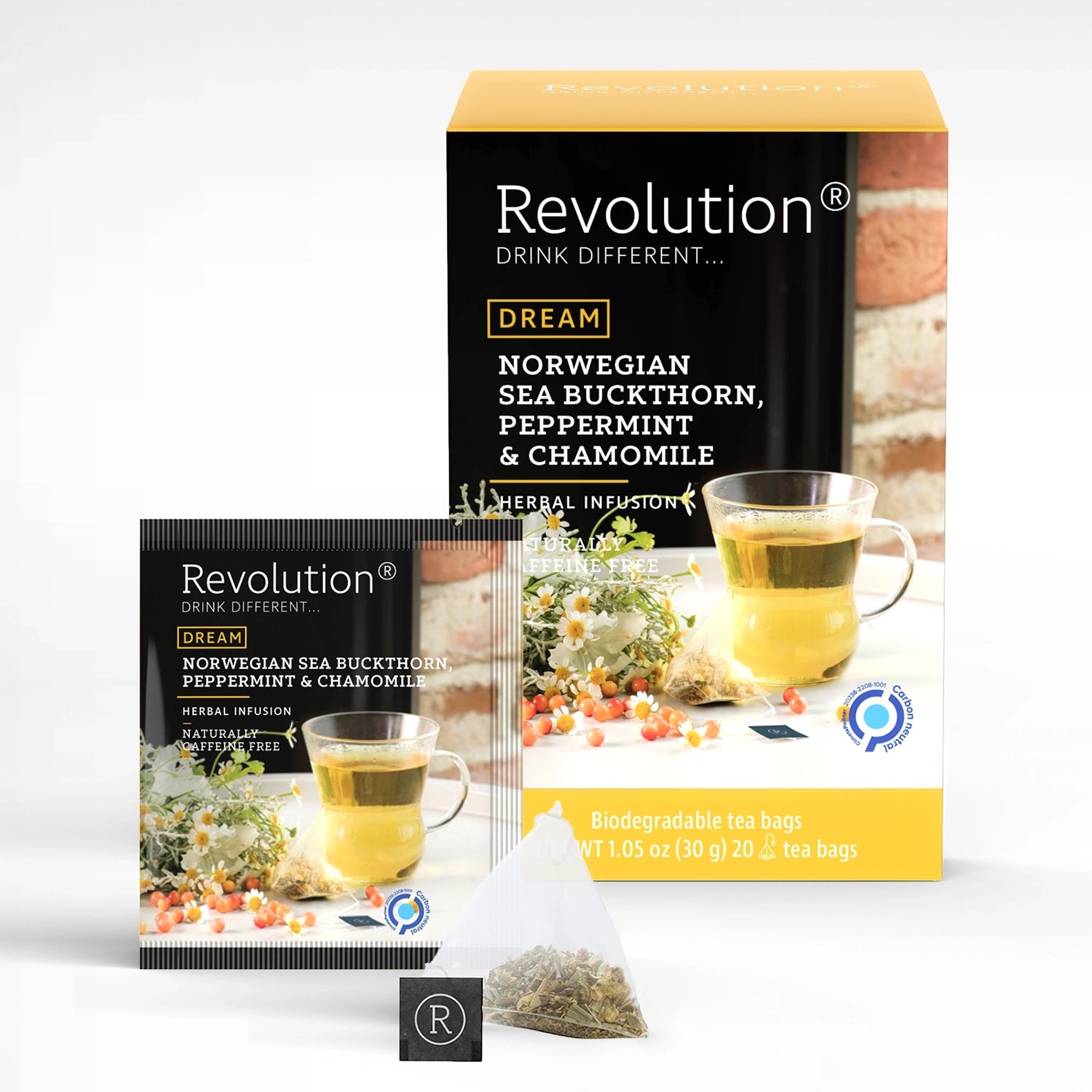 Packet and box of Dream Norwegian Sea Buckthorn, Peppermint & Chamomile tea with flowers and a cup.