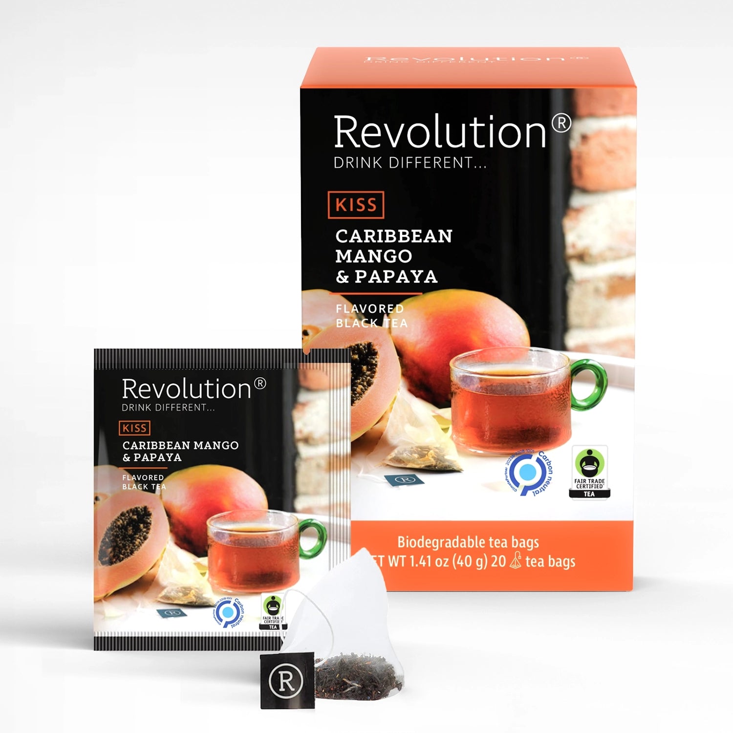 Packet and box of Kiss Caribbean Mango & Papaya flavored black tea with mango and papaya pieces.