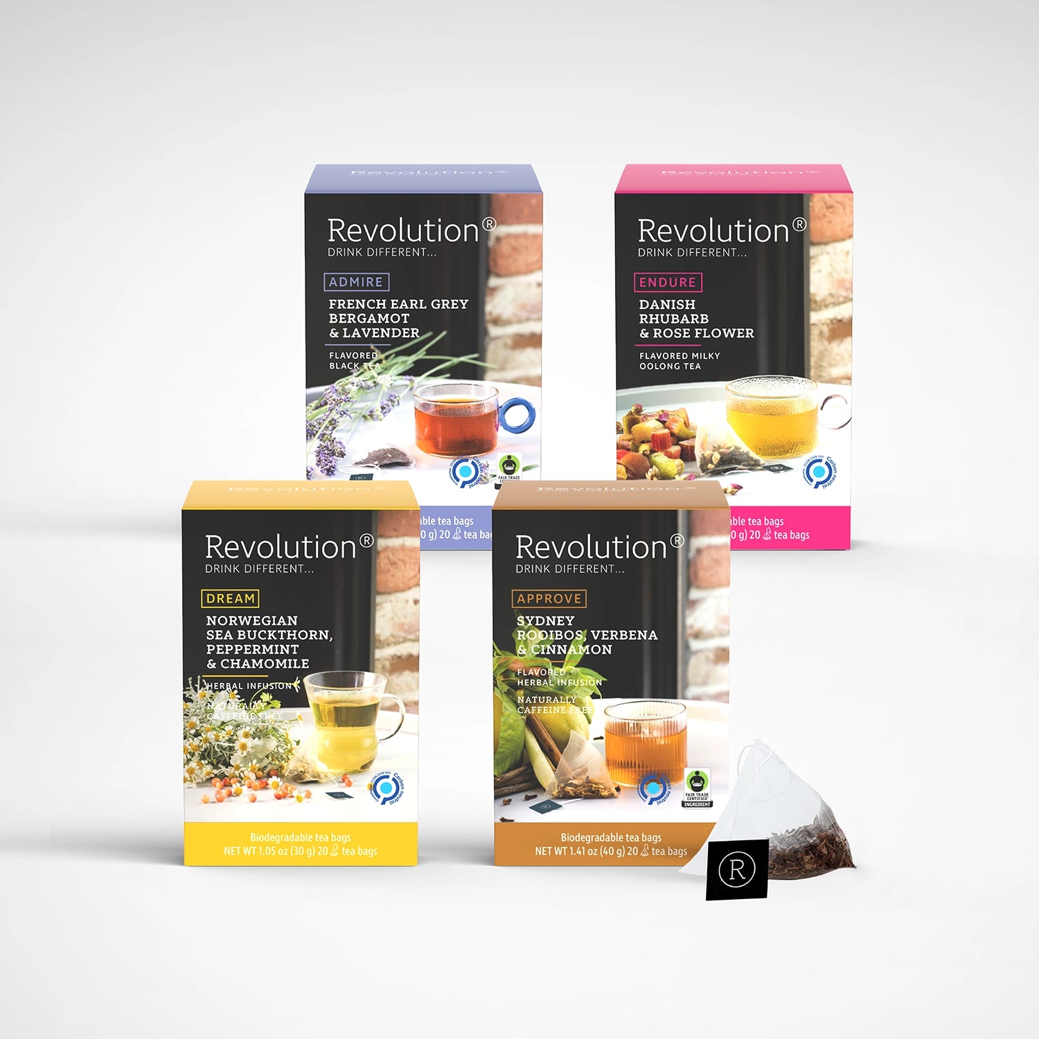 Four different tea blends in colorful packaging, featuring fruit and spice flavors.