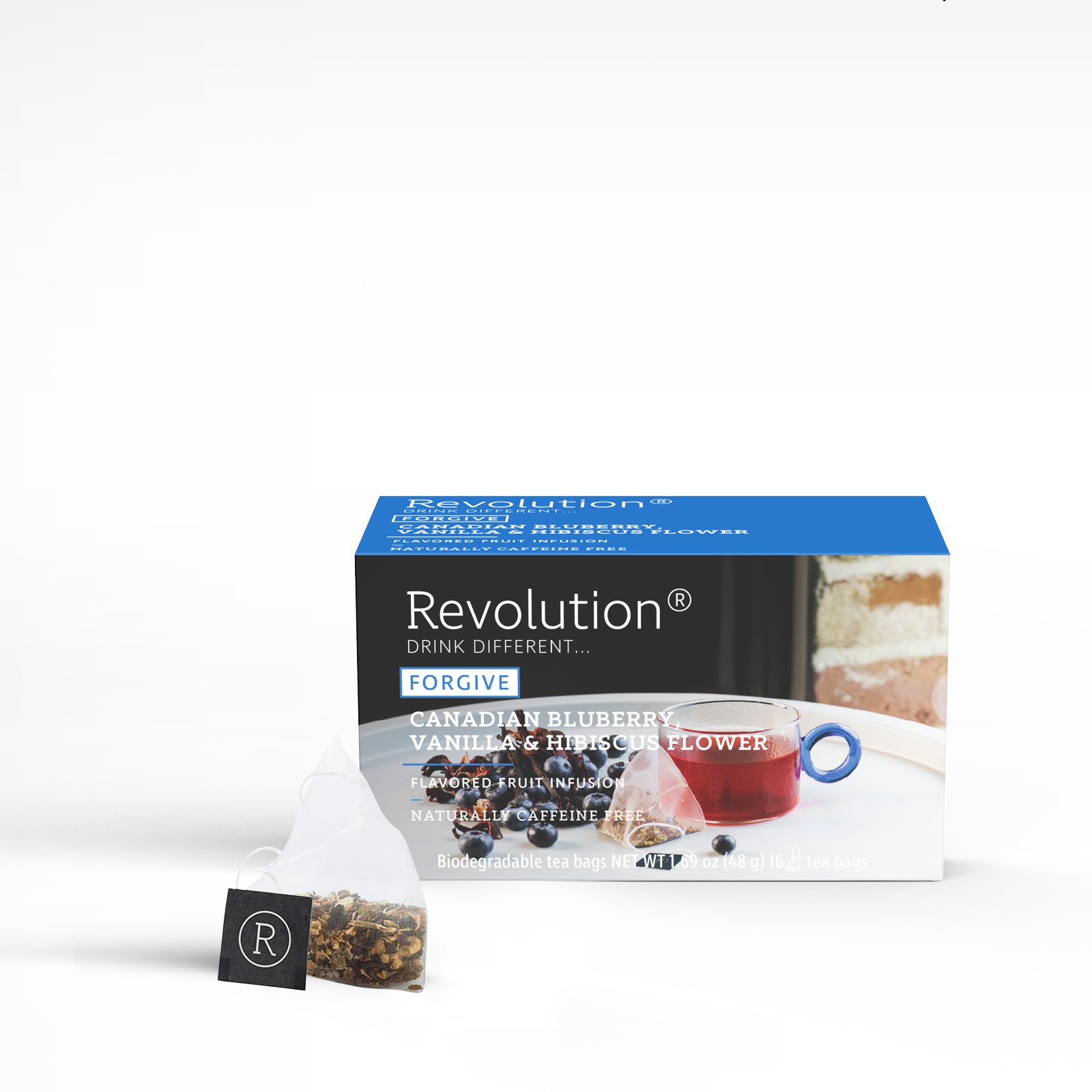 Forgive tea box with Canadian blueberry, vanilla, and hibiscus flower blend and a cup.