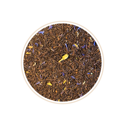 Dark tea leaves with blue and yellow petals in a circular frame.