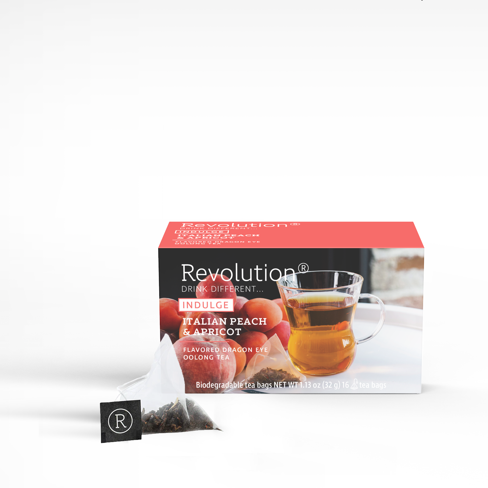 Indulge tea box with Italian peach and apricot blend alongside a clear cup of tea.