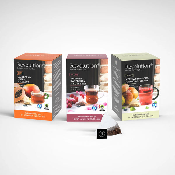 Three boxes of tea inspired by fruit flavors like mango and hibiscus.